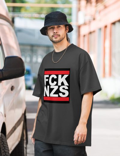 Make a bold statement with the FCK NZS Fuck Nazis Oversized Faded T-shirt. Printed with the vibrant and durable DTF (direct to film) technique, this shirt features a striking design to show your stance against fascism. Made from 100% carded cotton, it offers a boxy, oversized fit for ultimate comfort and style. Wear it proudly to raise awareness and stand up for what’s right.