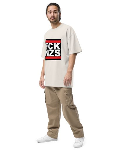 Make a bold statement with the FCK NZS Fuck Nazis Oversized Faded T-shirt. Printed with the vibrant and durable DTF (direct to film) technique, this shirt features a striking design to show your stance against fascism. Made from 100% carded cotton, it offers a boxy, oversized fit for ultimate comfort and style. Wear it proudly to raise awareness and stand up for what’s right.